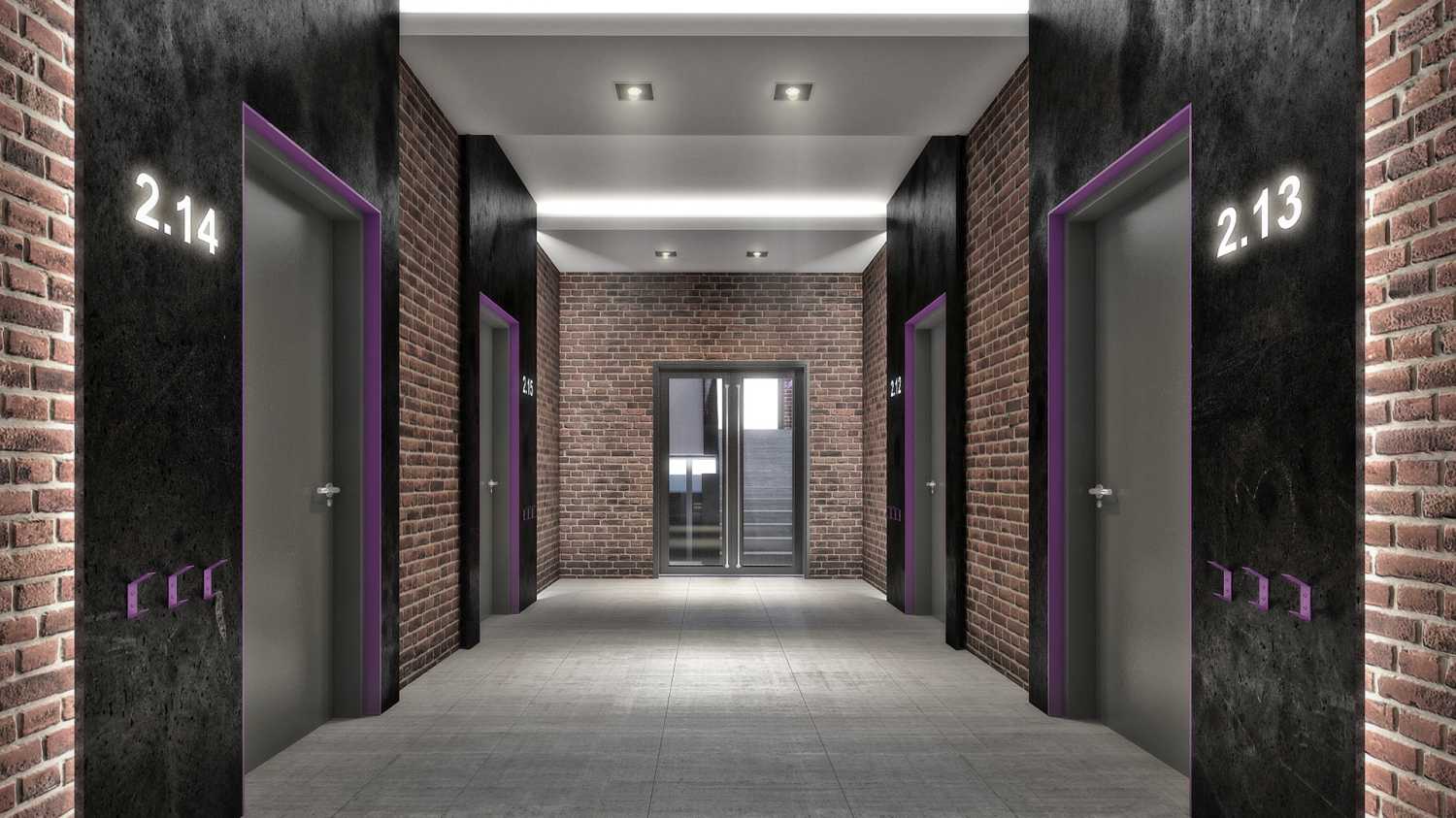 Входные группы Studio 12 декорированы в стиле «лофт» — на стенах состаренный кирпич, в отделке использован серый и черный архитектурный бетон.